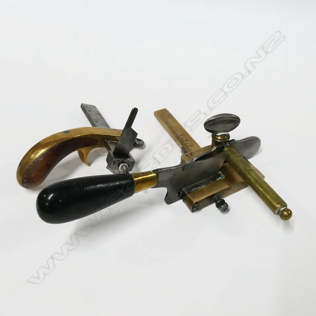 Blanchard, Paris, leather strap cutter or plow gauge; and a bronze & walnut pistol handled strap cutter (2) Image 1++