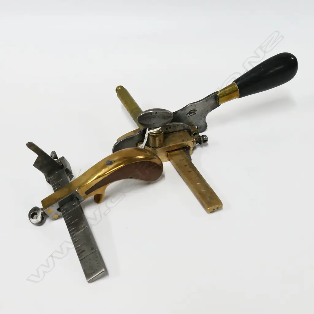Blanchard, Paris, leather strap cutter or plow gauge; and a bronze & walnut pistol handled strap cutter (2) Image 1++