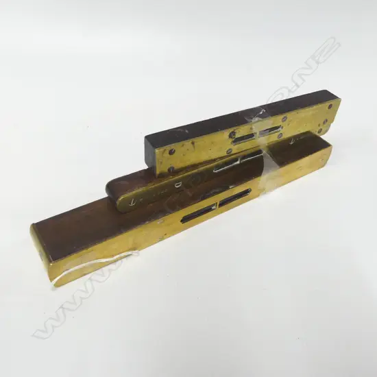 Three brass/wood levels