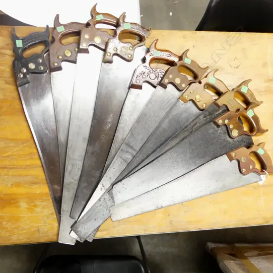 10 various panel saws. Note: the 2nd photo shows an example of how Nolan displayed his saws. The saws in this 2nd photo are not necessarily in this lot.