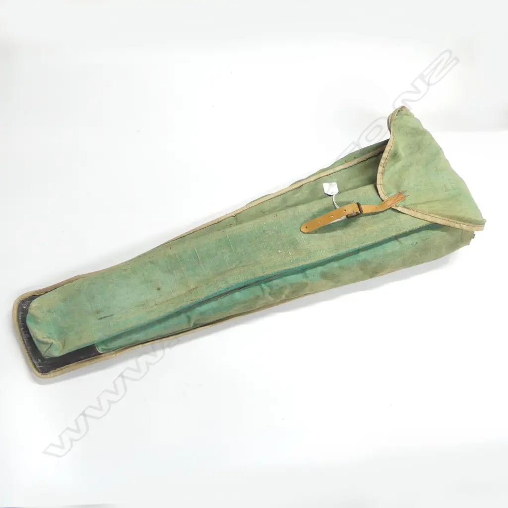 Two various panel saws and a Stanley Rule & Level Co brass and mahogany level, (Patented 1898 and earlier), in green canvas bag Image 1++