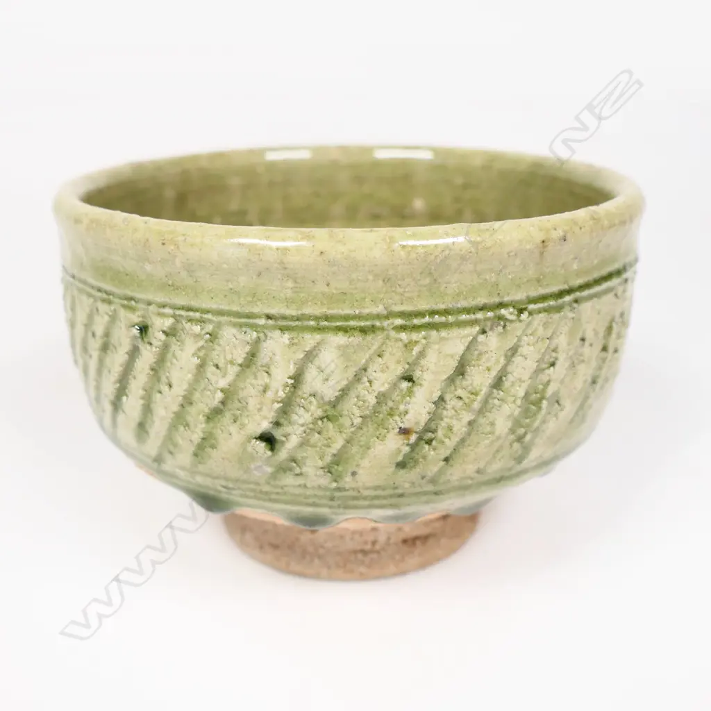 Mirek Smisek green glazed porcelain bowl cut sided decoration. Dia.130mm. Image 1++