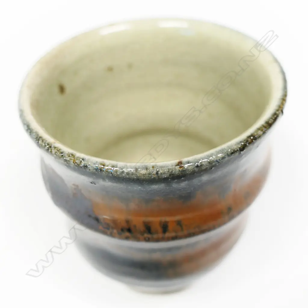 Mirek Smisek unomi rib sided rust red and blue glaze. Impressed potter's mark. H,95mm. Image 1++
