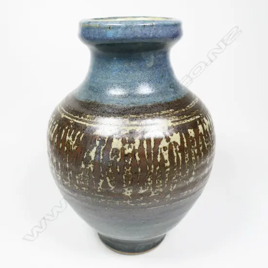 Mirek Smisek Baluster Vase. Band of wax resist pattern to the body on blue glaze . Impressed potter's mark. H.260mm