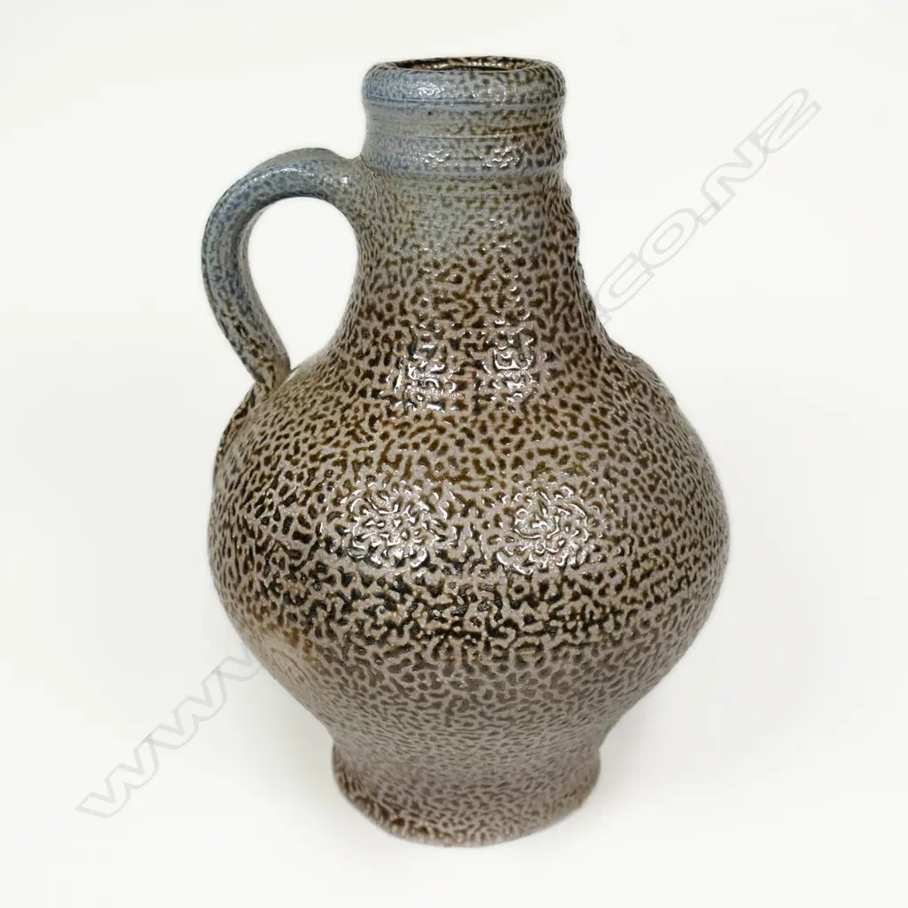 Graeme Storm Stoneware Bellarmine. Salt glazed w bearded mask panel. H.190mm. Image 1++