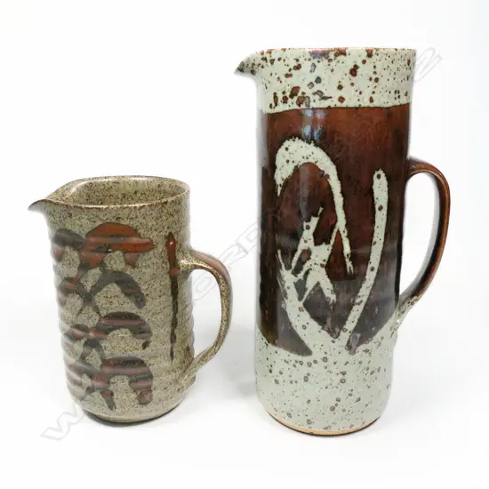 Two Adrian Cotter Jugs; salt glaze with bold wax-resist & brushed feather design. Tall - potter's mark to base H.255