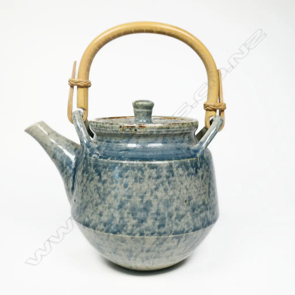 Doreen Blumhardt teapot dappled blue glaze. Bamboo handle. Impressed mark. Image 1++