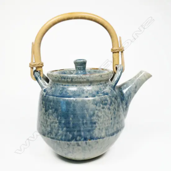 Doreen Blumhardt teapot dappled blue glaze. Bamboo handle. Impressed mark.