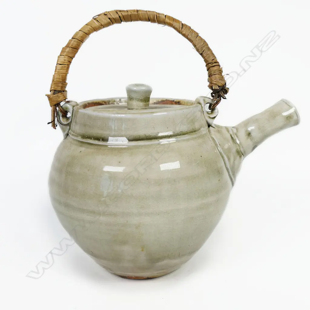 Chester Nealie Wood Fired Teapot. Gloss green glaze effects. Incised marks & paper label. Fibre bound copper handle. Image 1++