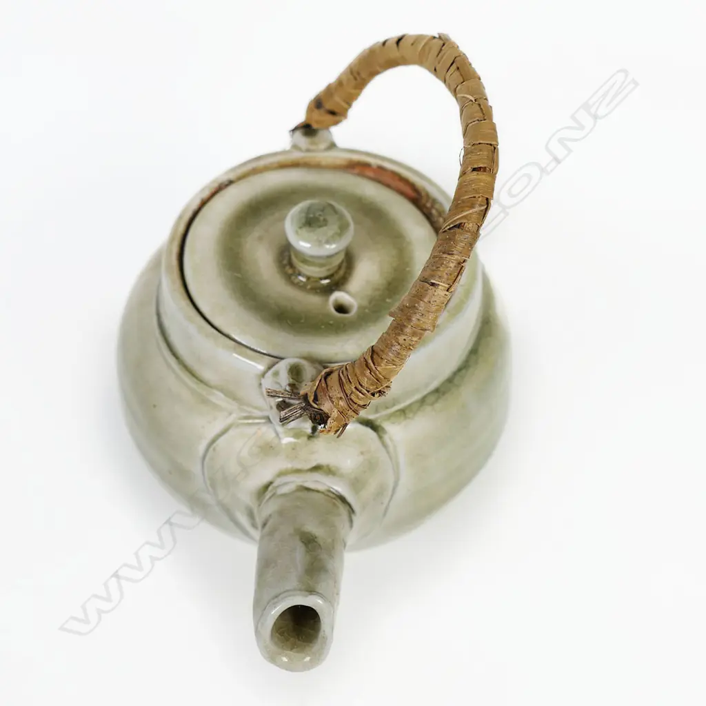 Chester Nealie Wood Fired Teapot. Gloss green glaze effects. Incised marks & paper label. Fibre bound copper handle. Image 1++