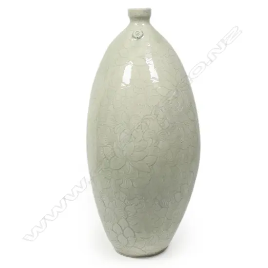 Keum Sun Lee/ Sang Sool Shim Lg Elliptical Bottle Form. Porcelain. Clear glaze over incised celadon ground. H.340mm