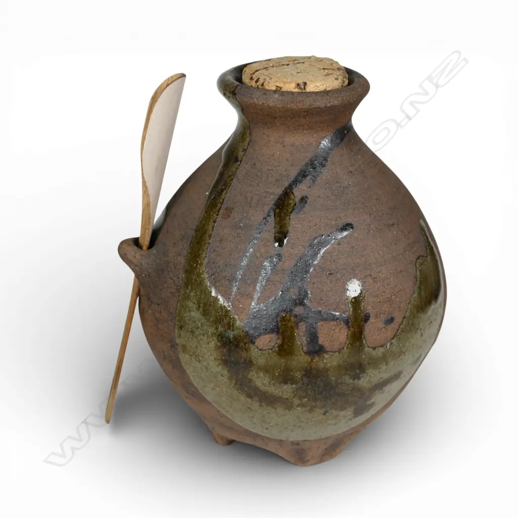 Patricia Perrin corked jar with bamboo spoon, dripped glaze decoration over unglazed body with lug to side. H.145mm. Makers stamp to base Image 1++