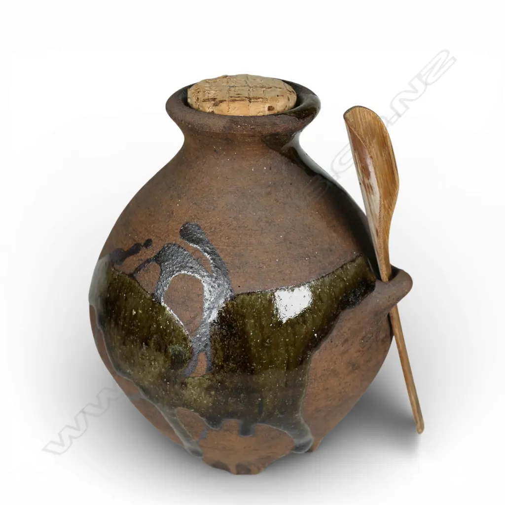 Patricia Perrin corked jar with bamboo spoon, dripped glaze decoration over unglazed body with lug to side. H.145mm. Makers stamp to base Image 1++