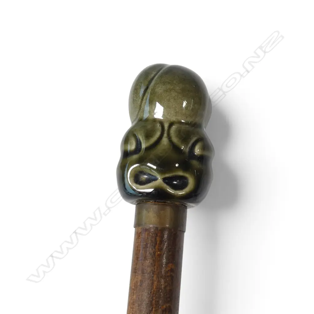 A vintage ceramic tiki form handled walking stick Image 1++