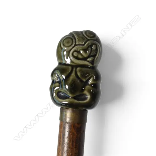A ceramic tiki form handled walking stick
