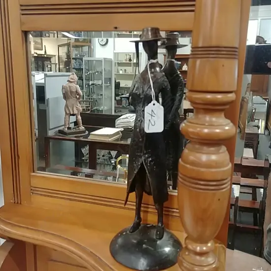 STYLISED BRONZE FIGURE OF A WOMAN