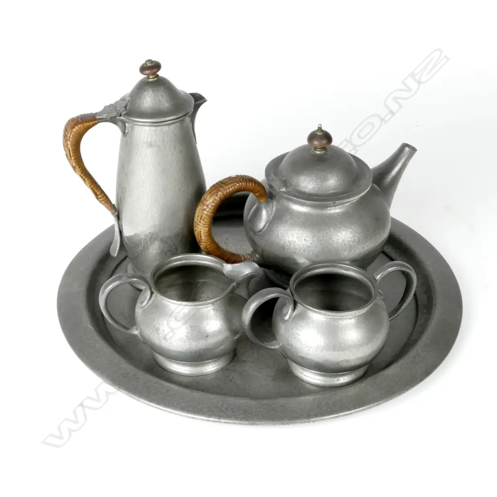 A five piece hand beaten Tudric pewter tea set made by Liberty & Co. Image 1++