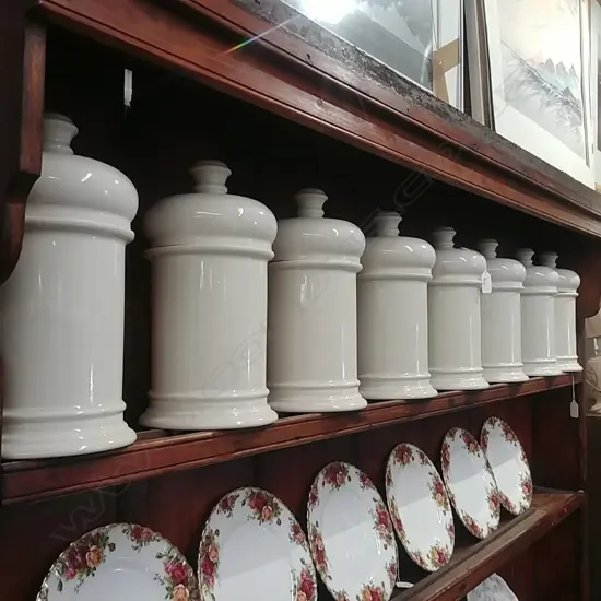 EIGHT CREAM PORCELAIN CANNISTERS / JARS
