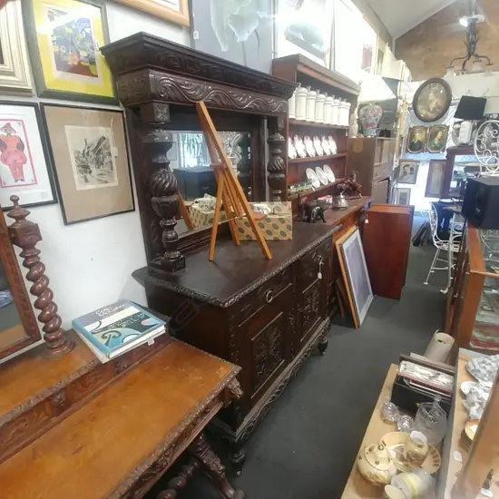 RELIEF CARVED MIRROR-BACK OAK SIDEBOARD