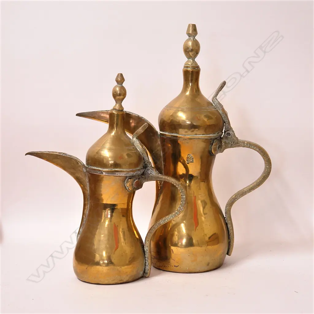 A pair of old Turkish graduated coffee pots Image 1++
