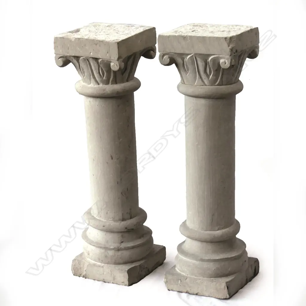 A pair of small concrete Corinthian columns Image 1++