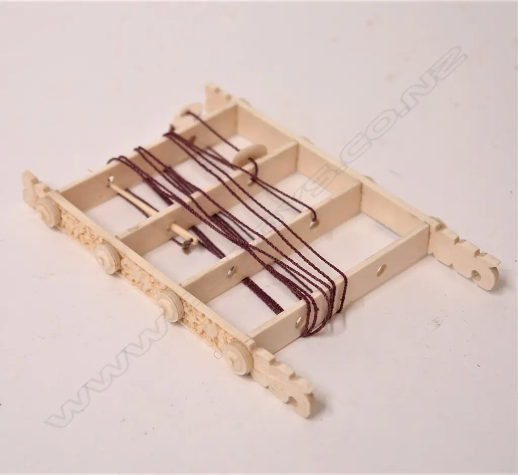 A 19thC carved ivory ladder puzzle Image 1++