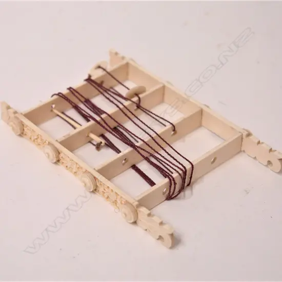 A 19thC carved ivory ladder puzzle