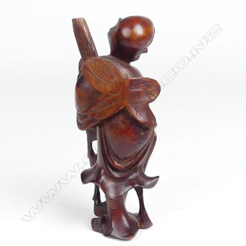 A Chinese carved rosewood figure of Gamma Sennin Image 1++