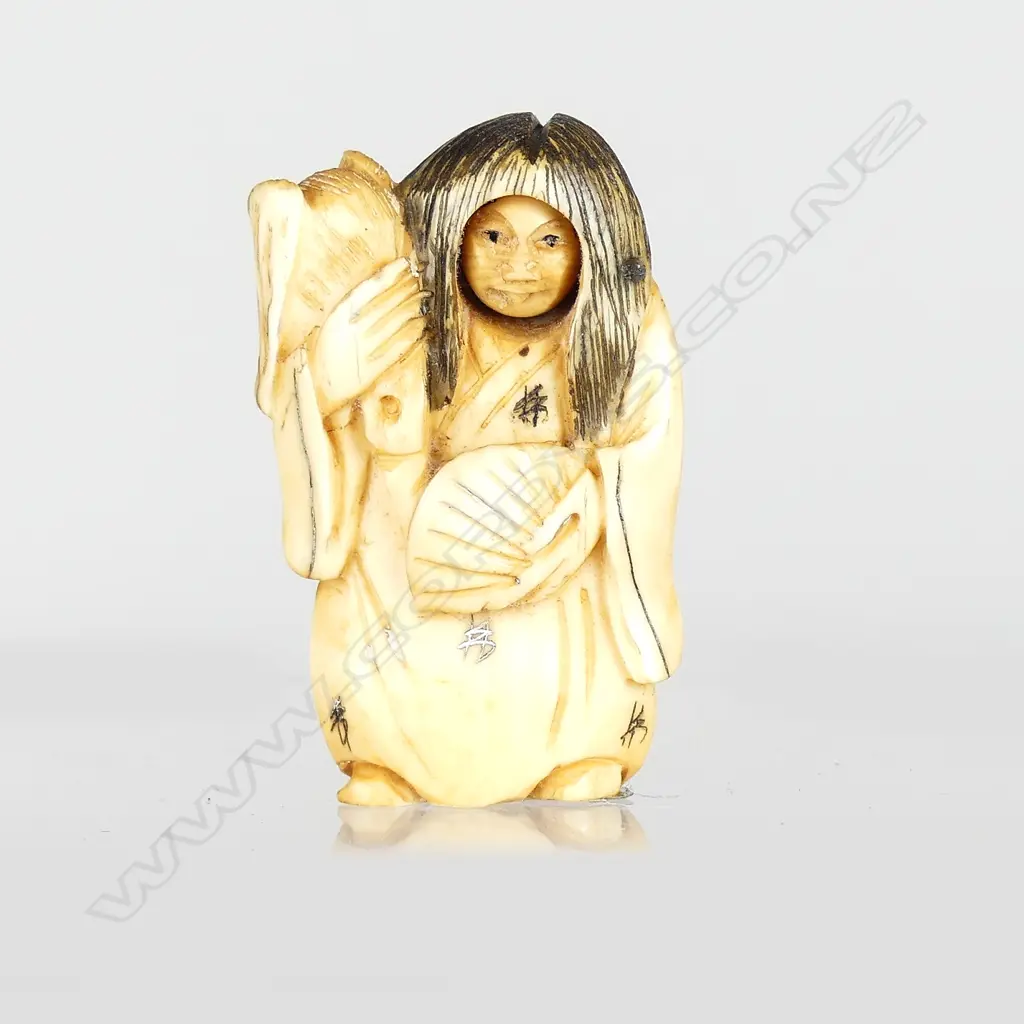 A Japanese netsuke of a demon Image 1++