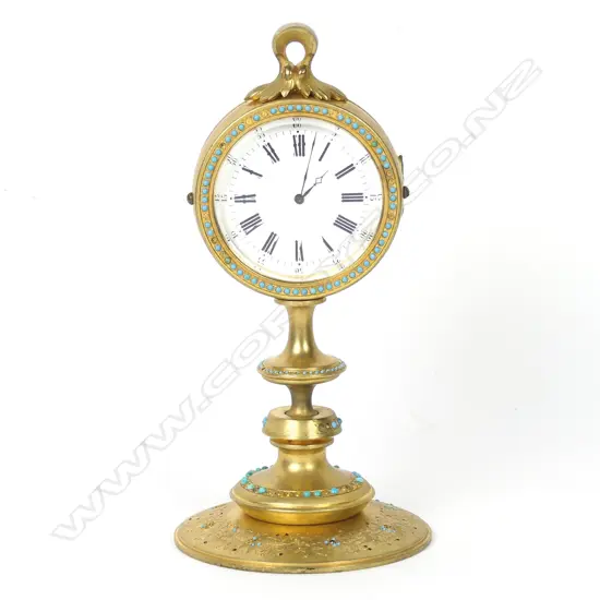 A European small gilt bronze table clock