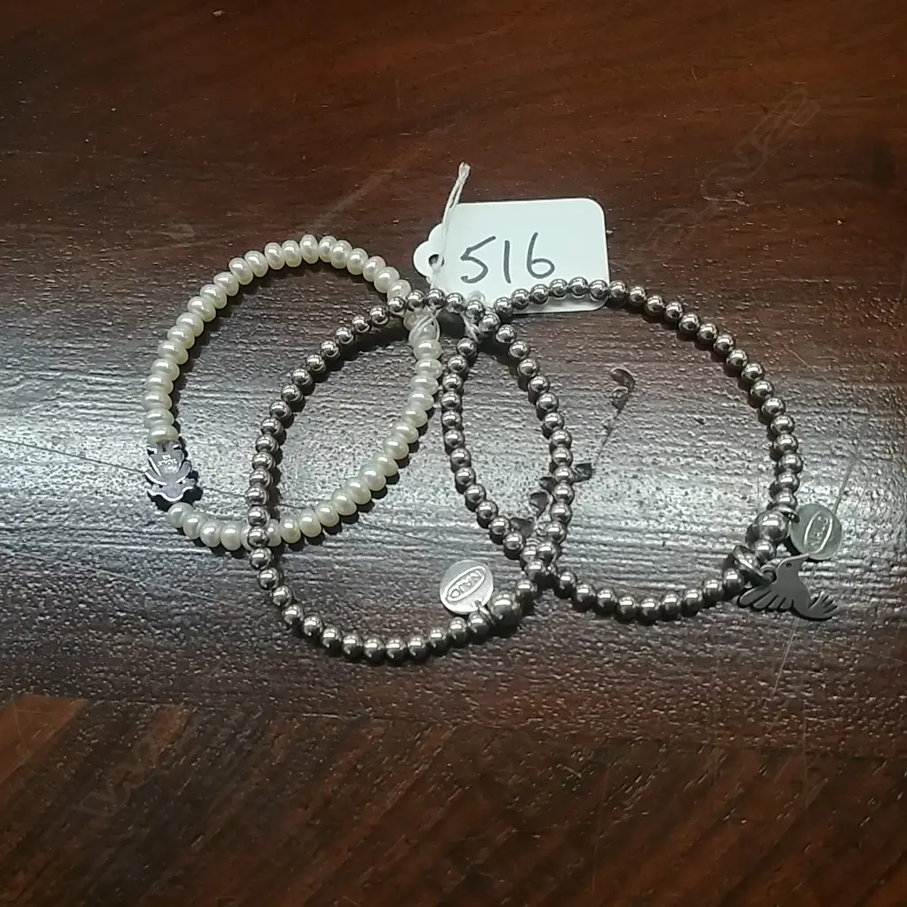 THREE BRACELETS Image 1++