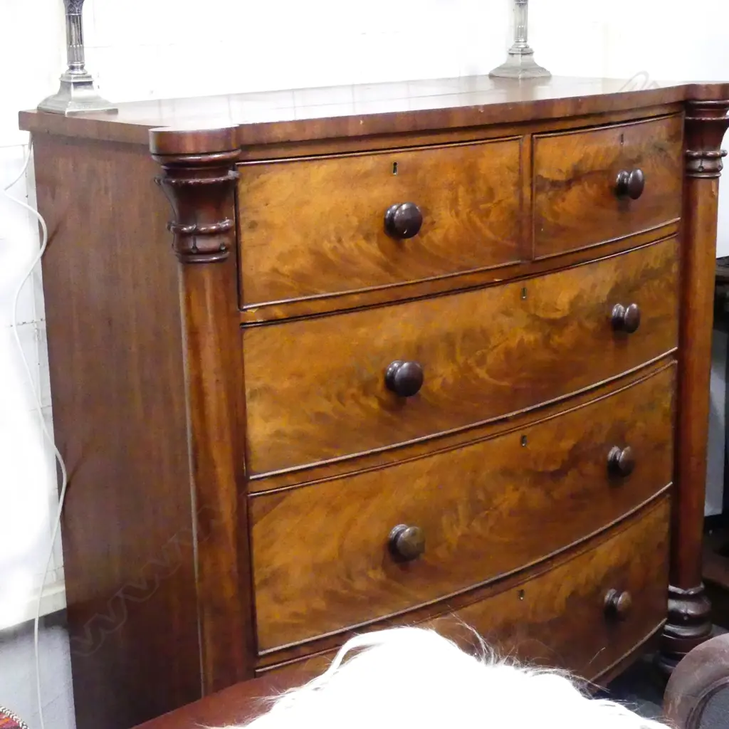 A Victorian mahogany five drawer bow front chest Image 1++