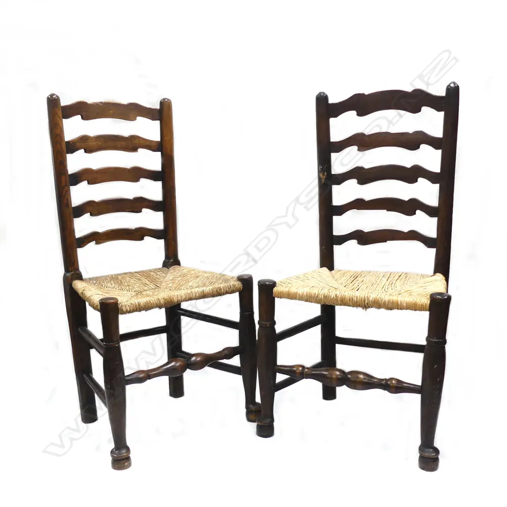 A pair of country oak rush seated ladderback chairs Image 1++