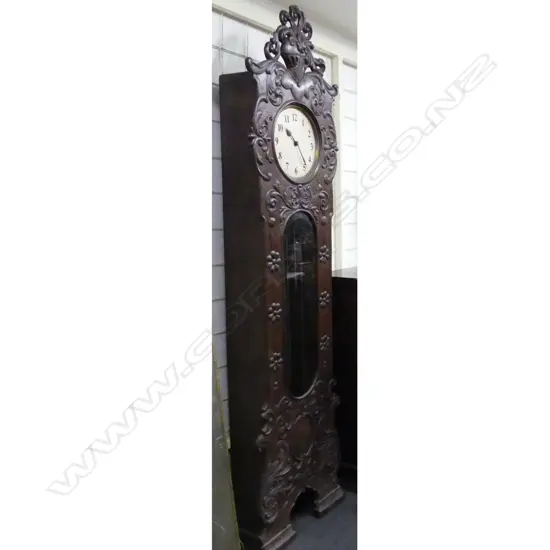 A 1930s antique style carved long case clock