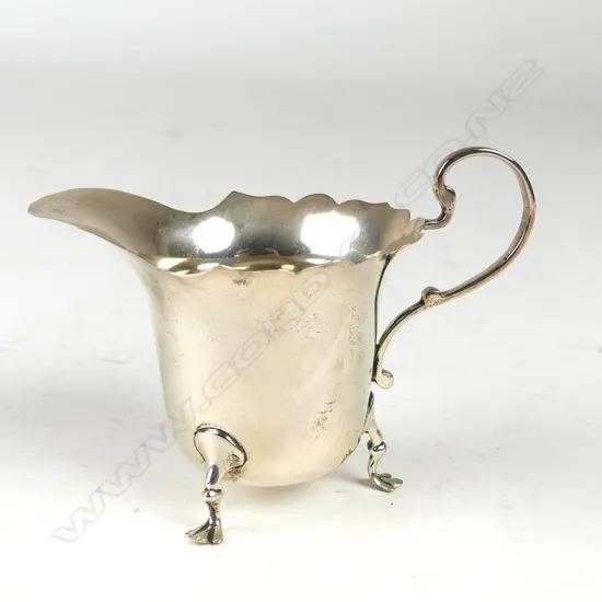 A silver small cream jug