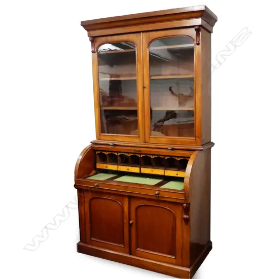 A Victorian mahogany bookcase cylinder front bureau