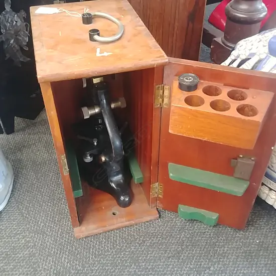 CASED MICROSCOPE