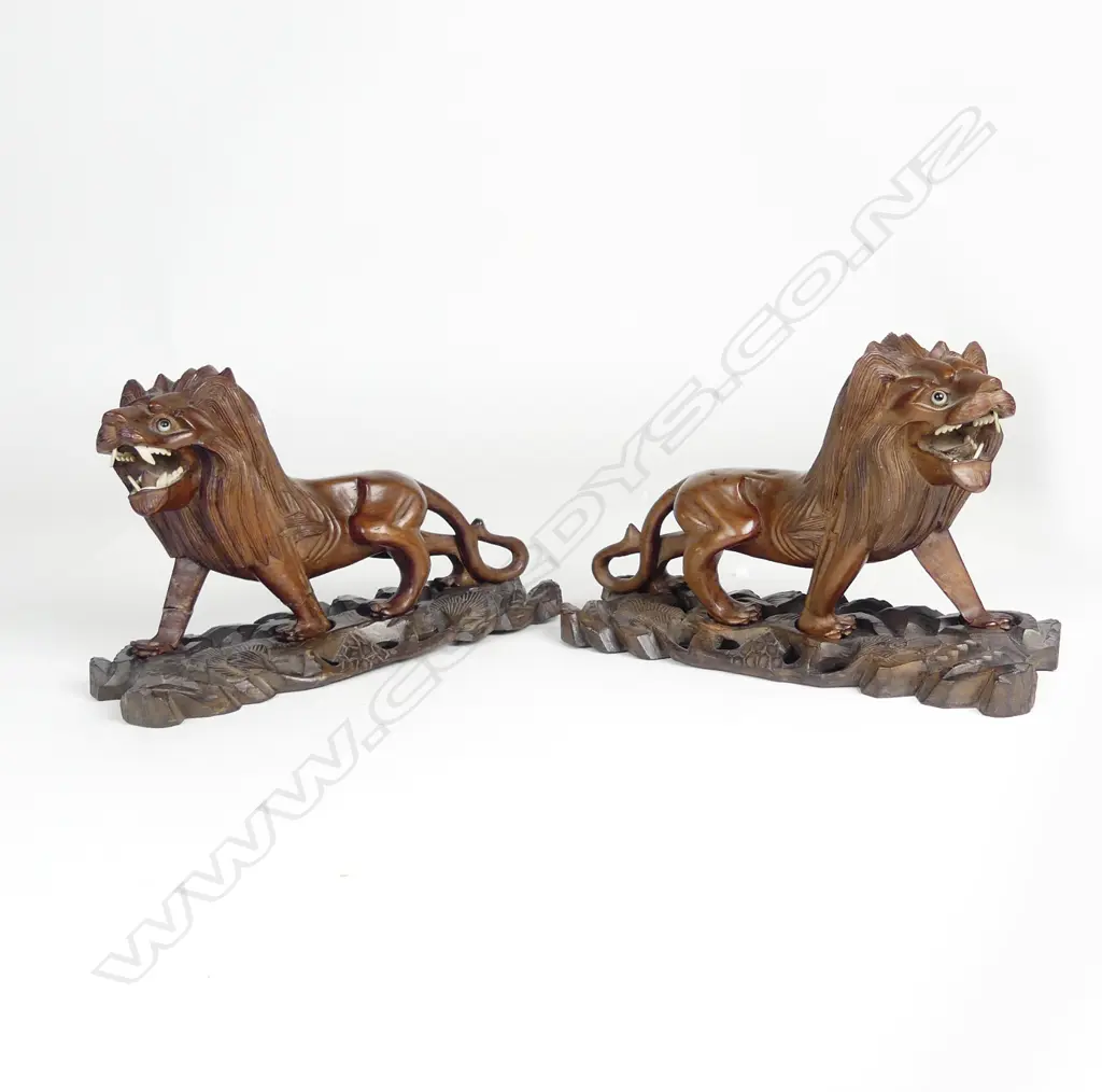 A pair of early 20thC Chinese hardwood carved prowling lions Image 1++