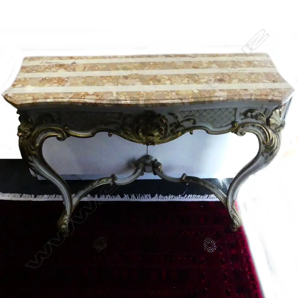 A Louis XV style parcel gilt marble topped console table Image 1++