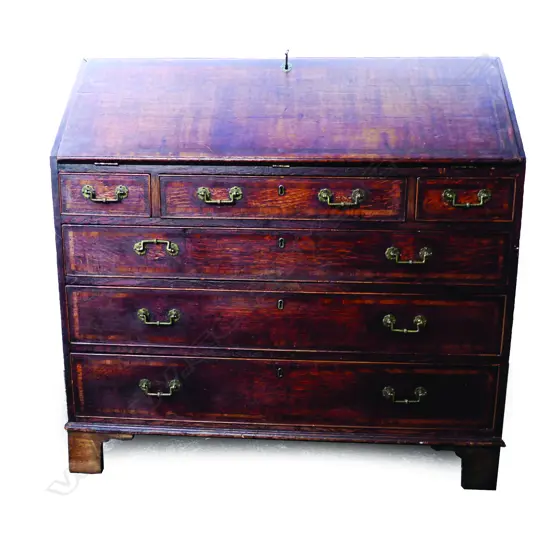 A Georgian oak drop front bureau