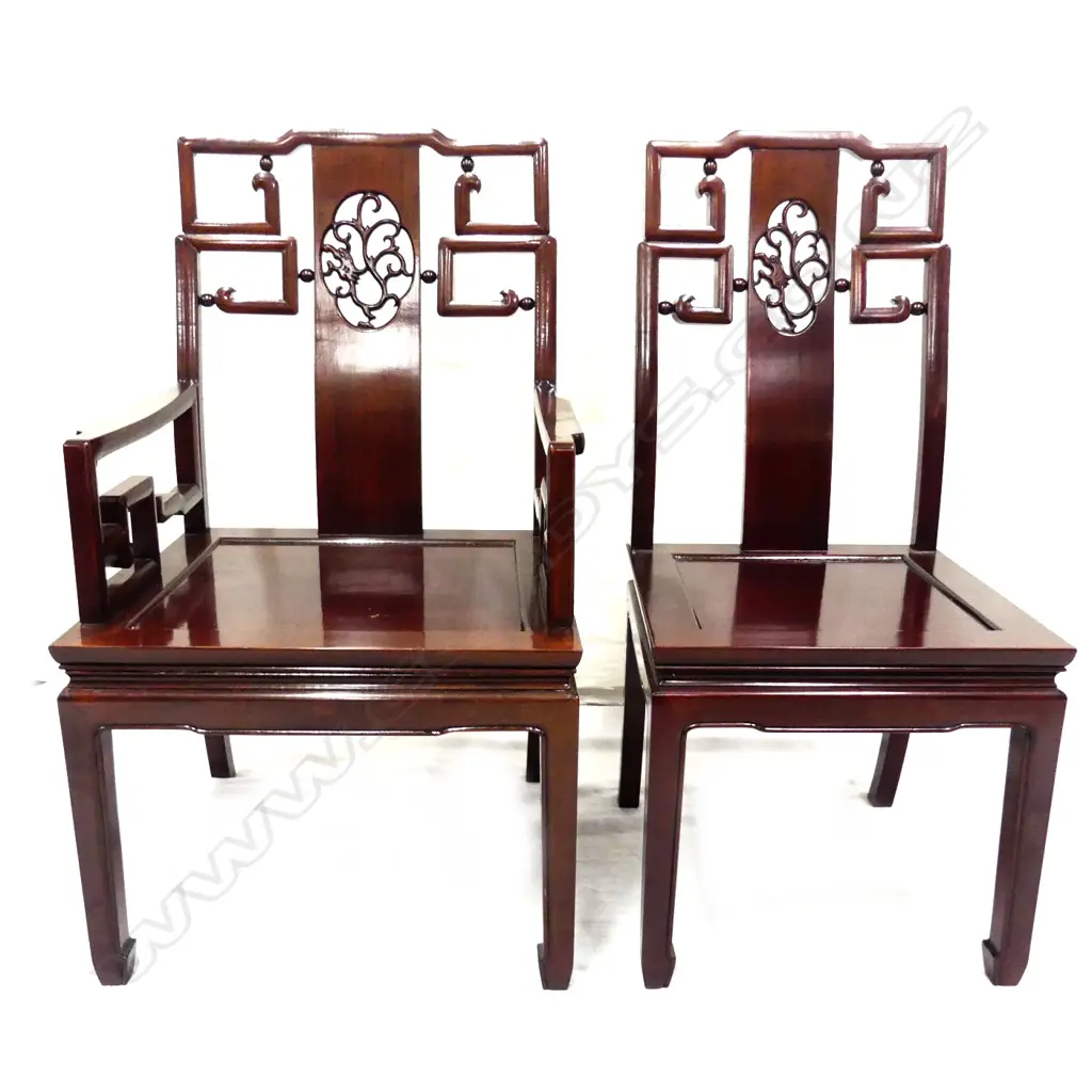 A Chinese rosewood dining table and chairs Image 1++