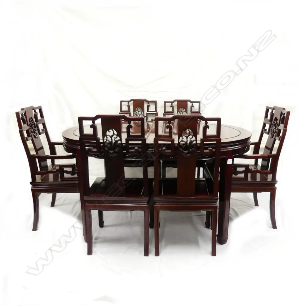 A Chinese rosewood dining table and chairs Image 1++