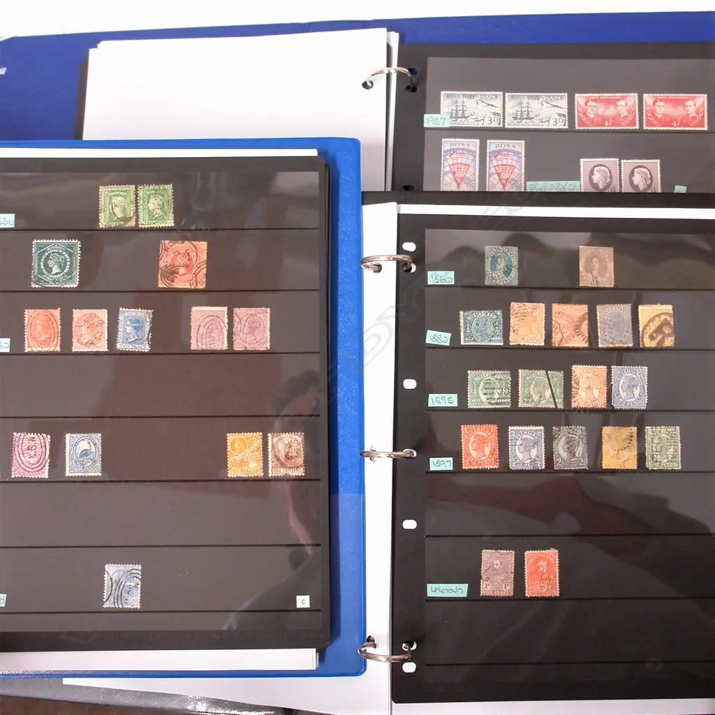 Three albums of world stamps Image 1++