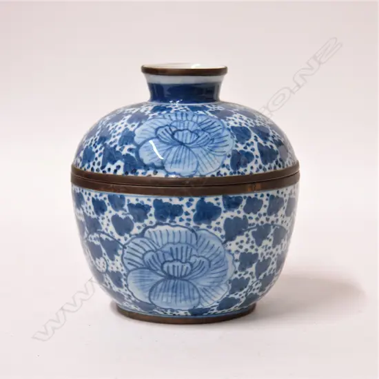 An old Chinese blue and white lidded bowl with brass mounts