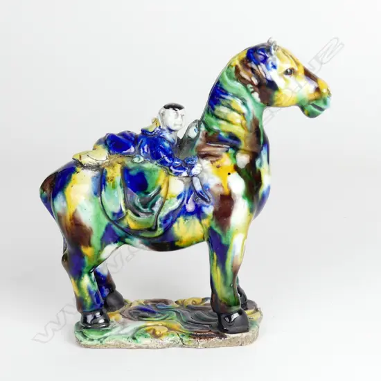 A Chinese porcelain small statuette of a horse and rider