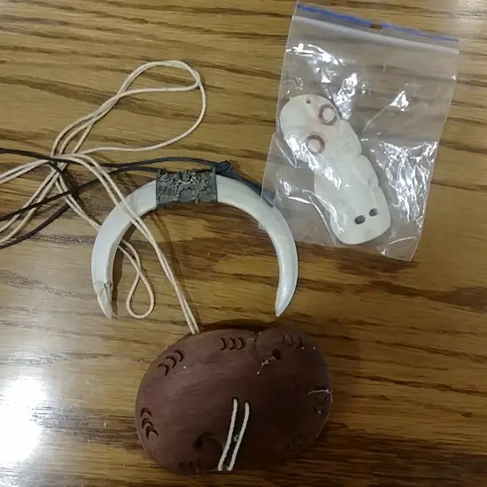 3 CARVED PENDANTS INCL. TIKI