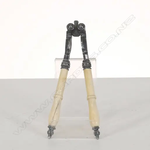 A PAIR OF IVORY HANDLED NUT CRACKERS Image 1++