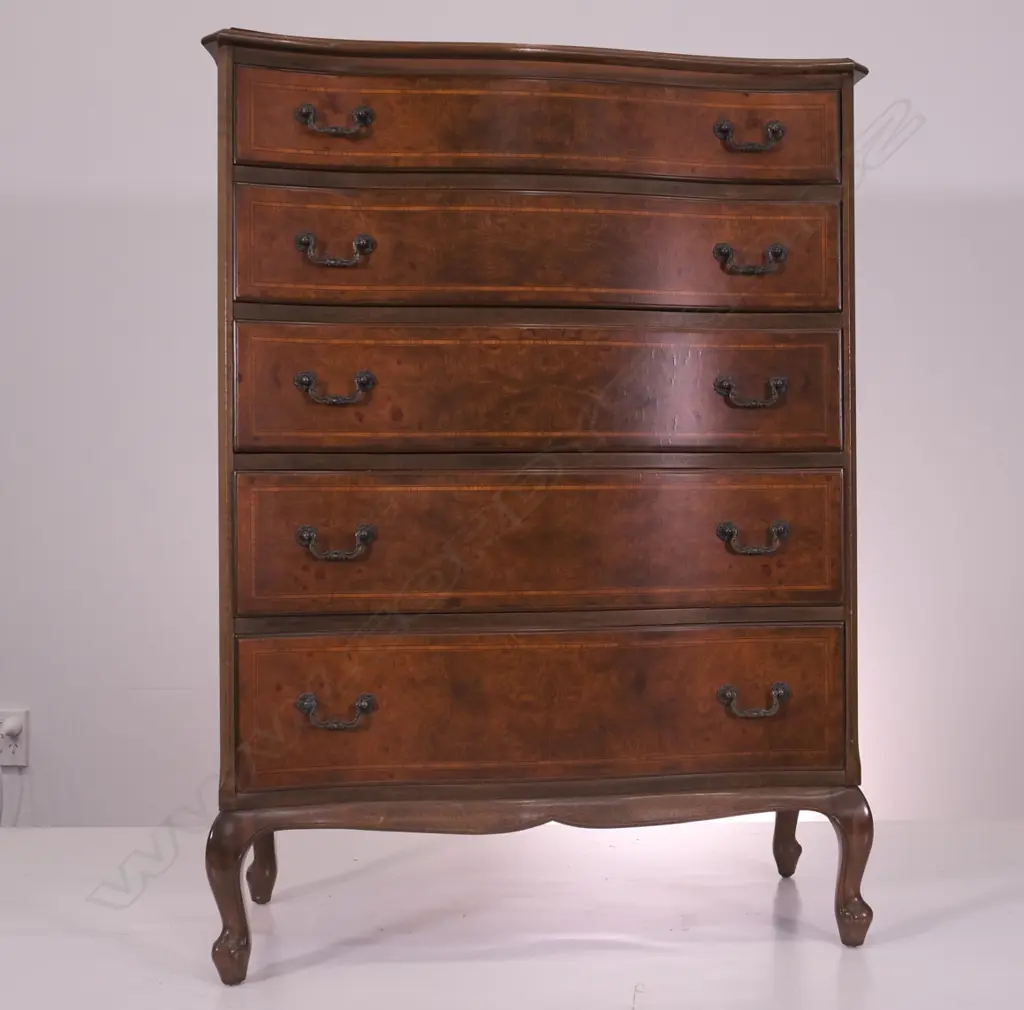 A WALNUT SHAPED FRONT 5 DRAWER TALLBOY, H 1160 MM SMALL VENEER DAMAGE TO TOP Image 1++