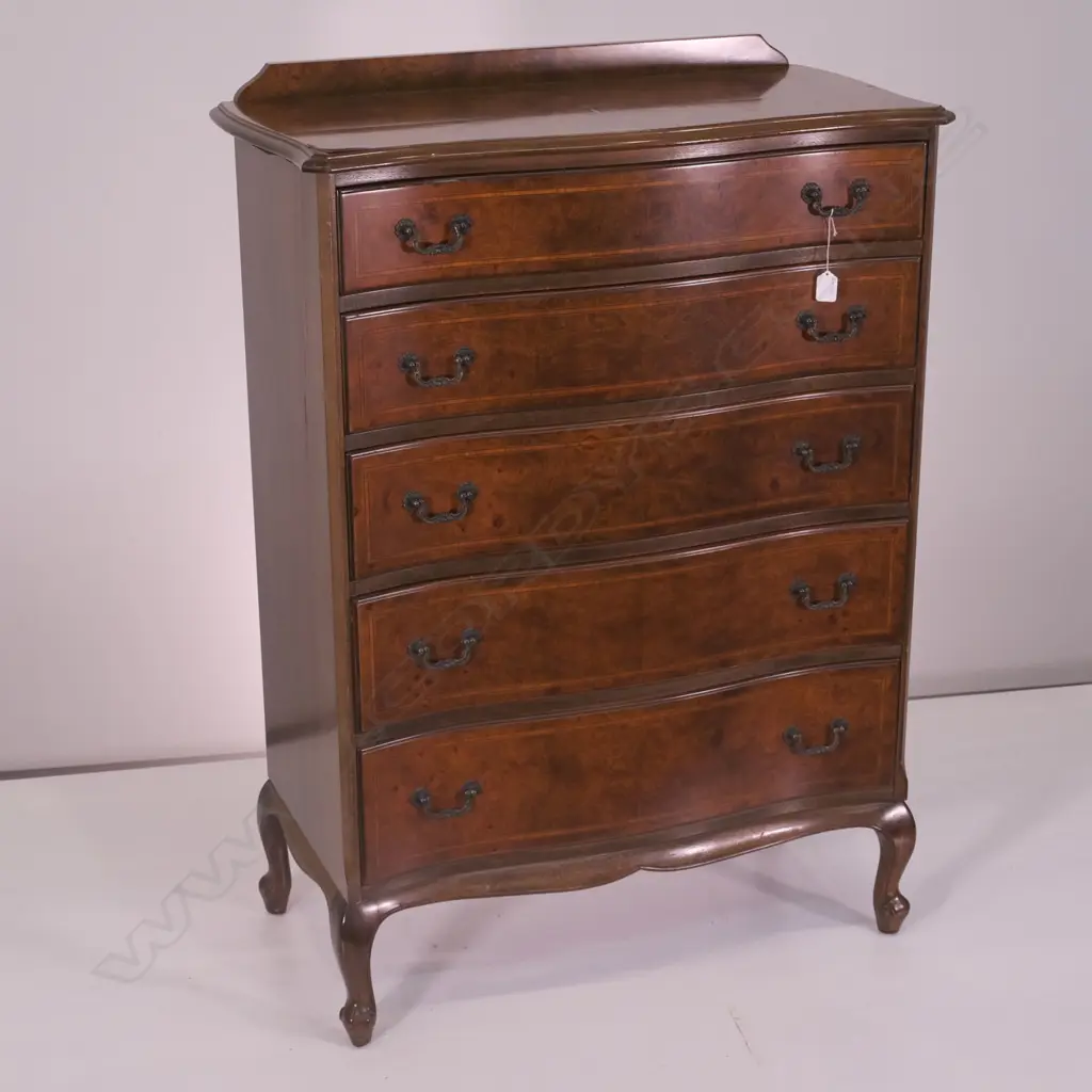A WALNUT SHAPED FRONT 5 DRAWER TALLBOY, H 1160 MM SMALL VENEER DAMAGE TO TOP Image 1++