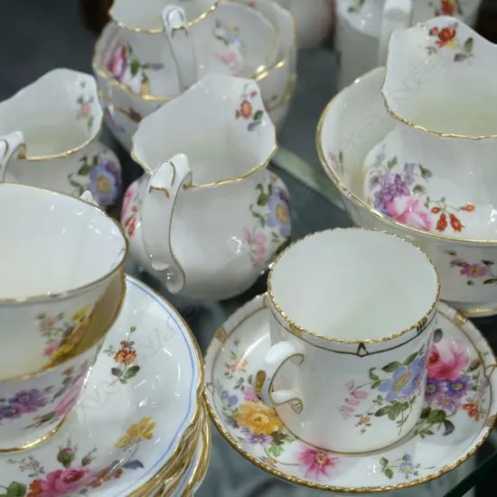 Coffee pot; three milk jugs